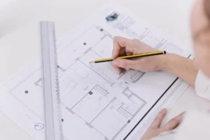 Architectural drawings and blueprints on the table for a conceptual design project